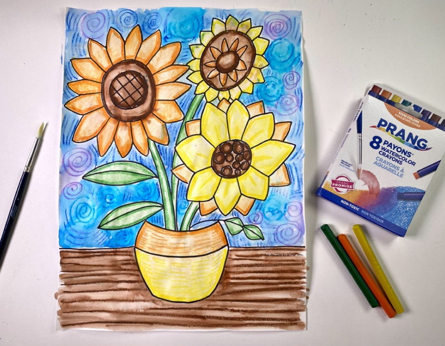 Colorful sunflower artwork with art supplies, featuring vibrant colors and textures.