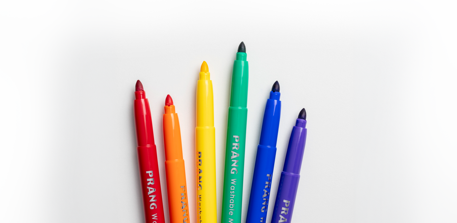 Six colorful Prang washable markers arranged neatly on a white background.