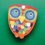 A vibrant collage of an owl crafted from our Construction Paper Samplers, highlighting its large blue eyes and multicolored feathers against a lush green backdrop.